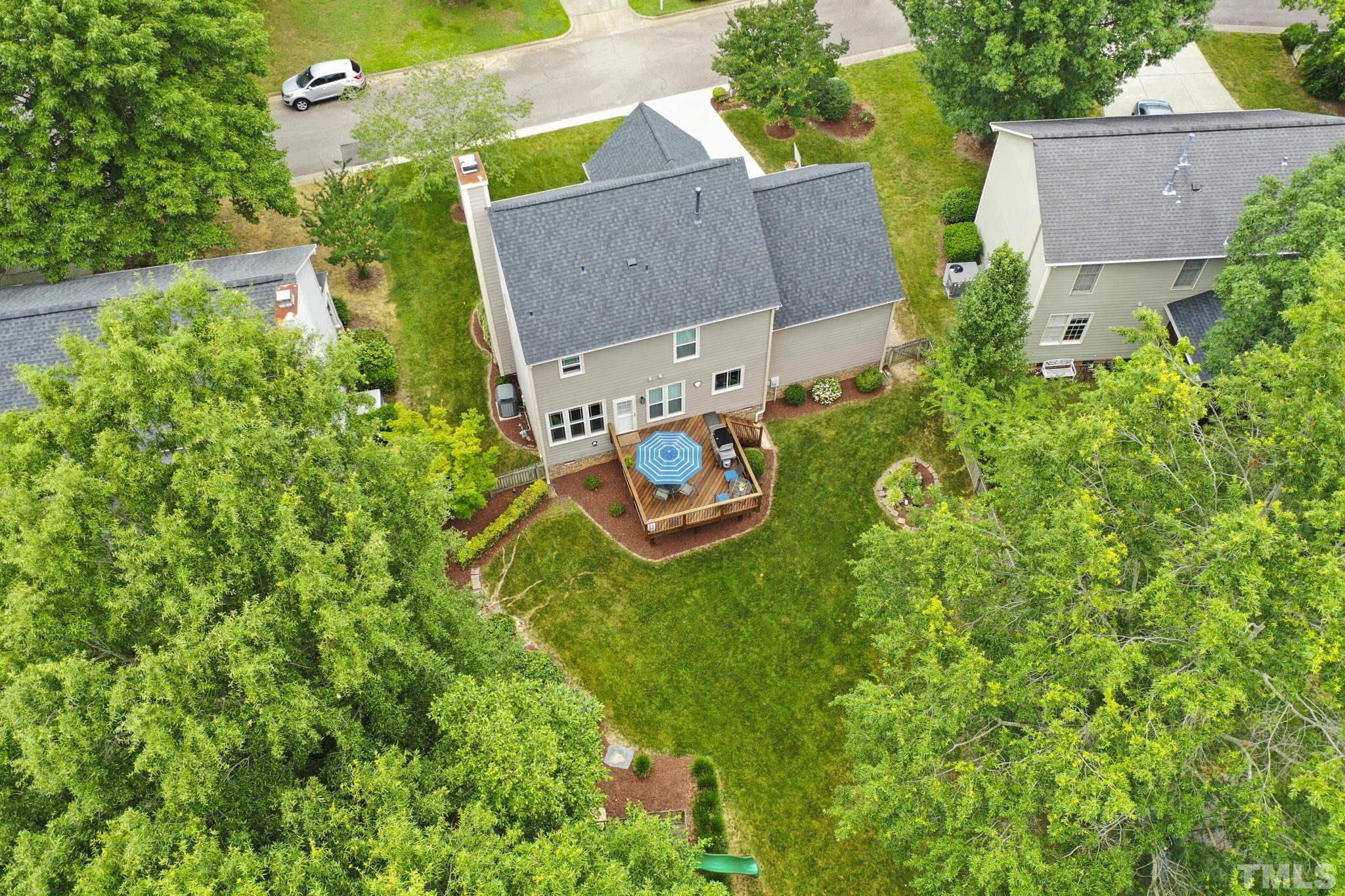 102 Sequoia Court Cary, NC 27513 - Photo 12 of 36 an aerial view of house with yard and outdoor seating