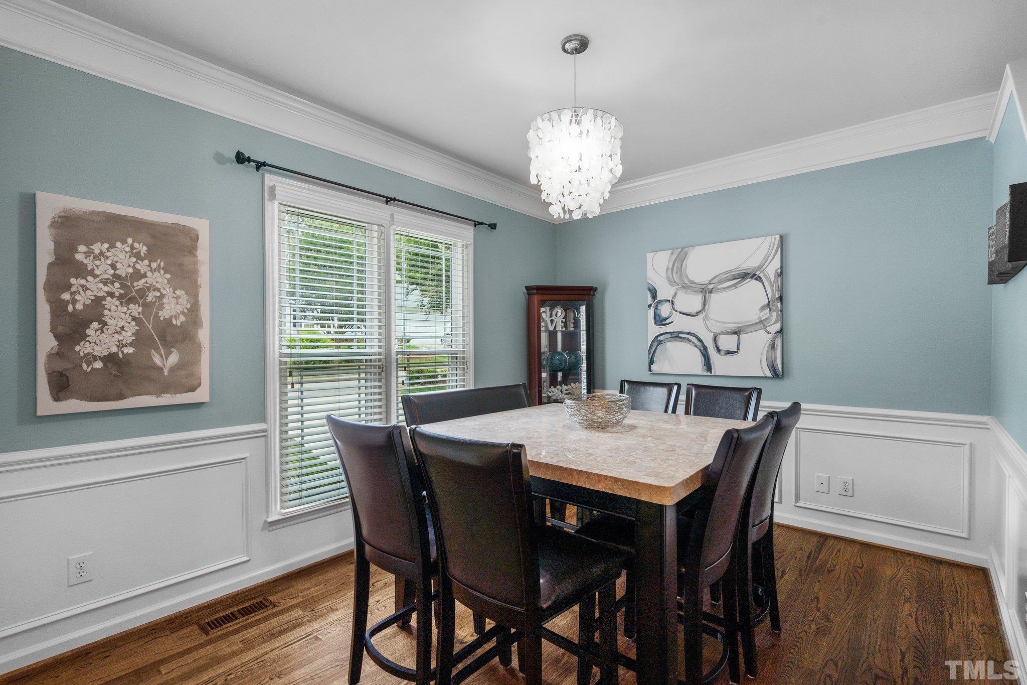 102 Sequoia Court Cary, NC 27513 - Photo 13 of 36 a view of a dining room with furniture wooden floor and chandelier