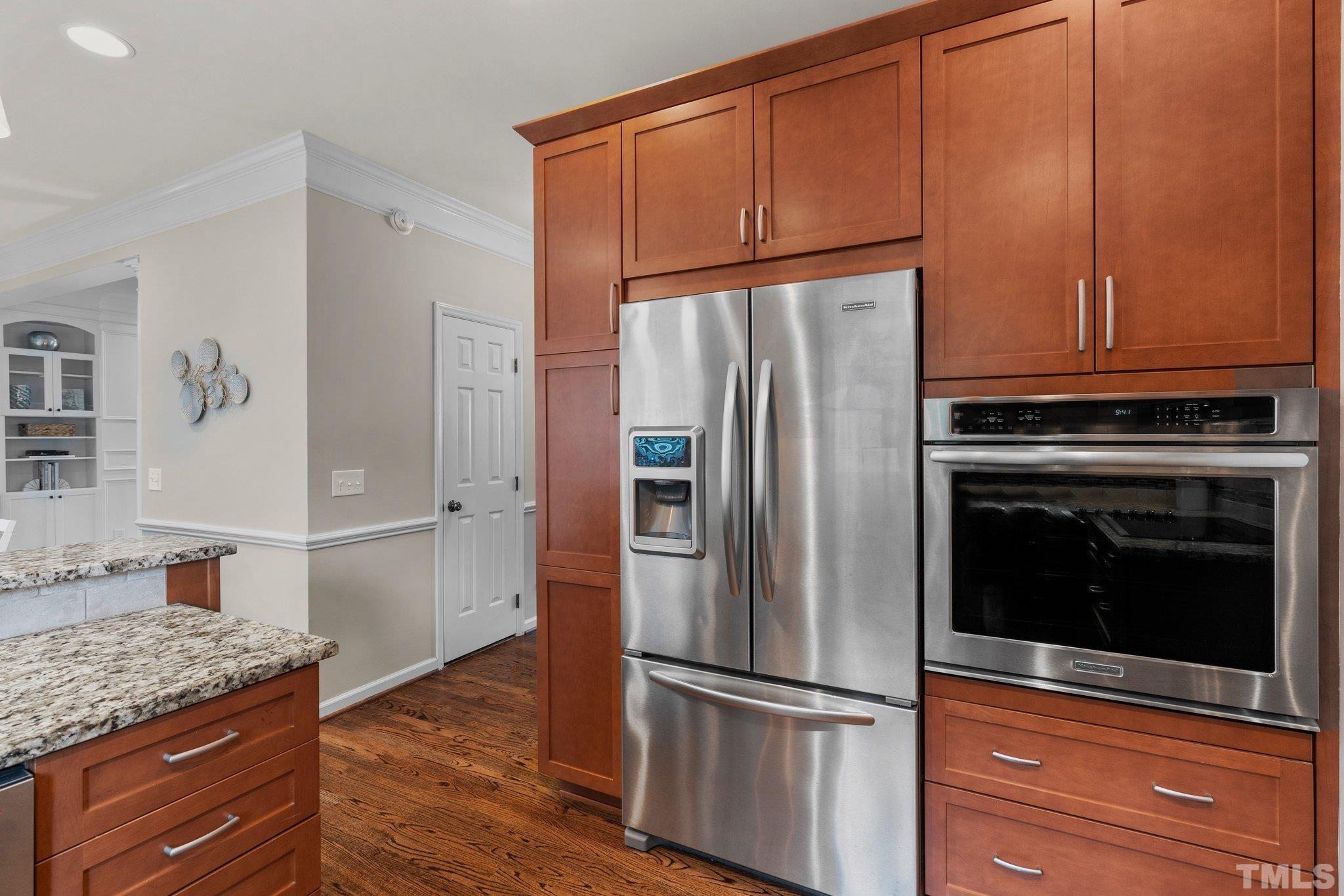 102 Sequoia Court Cary, NC 27513 - Photo 17 of 36 a kitchen with granite countertop stainless steel appliances and refrigerator