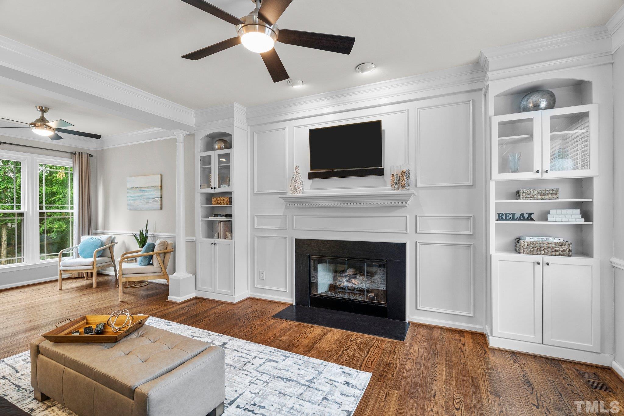 102 Sequoia Court Cary, NC 27513 - Photo 22 of 36 a living room with furniture a flat screen tv and a fireplace
