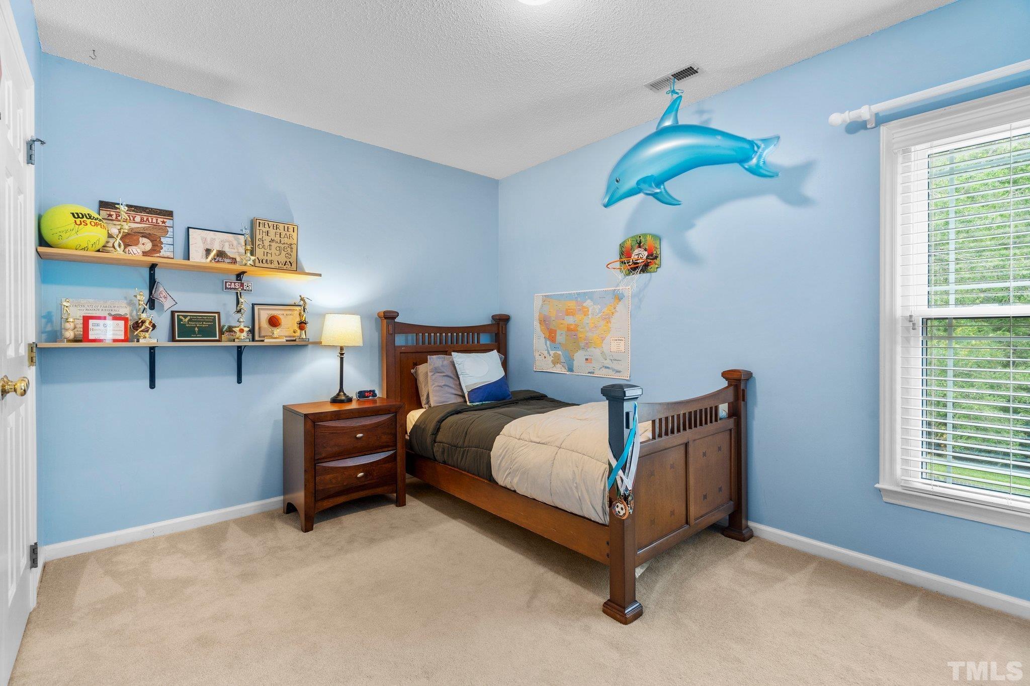 102 Sequoia Court Cary, NC 27513 - Photo 25 of 36 a bedroom with a bed and a window