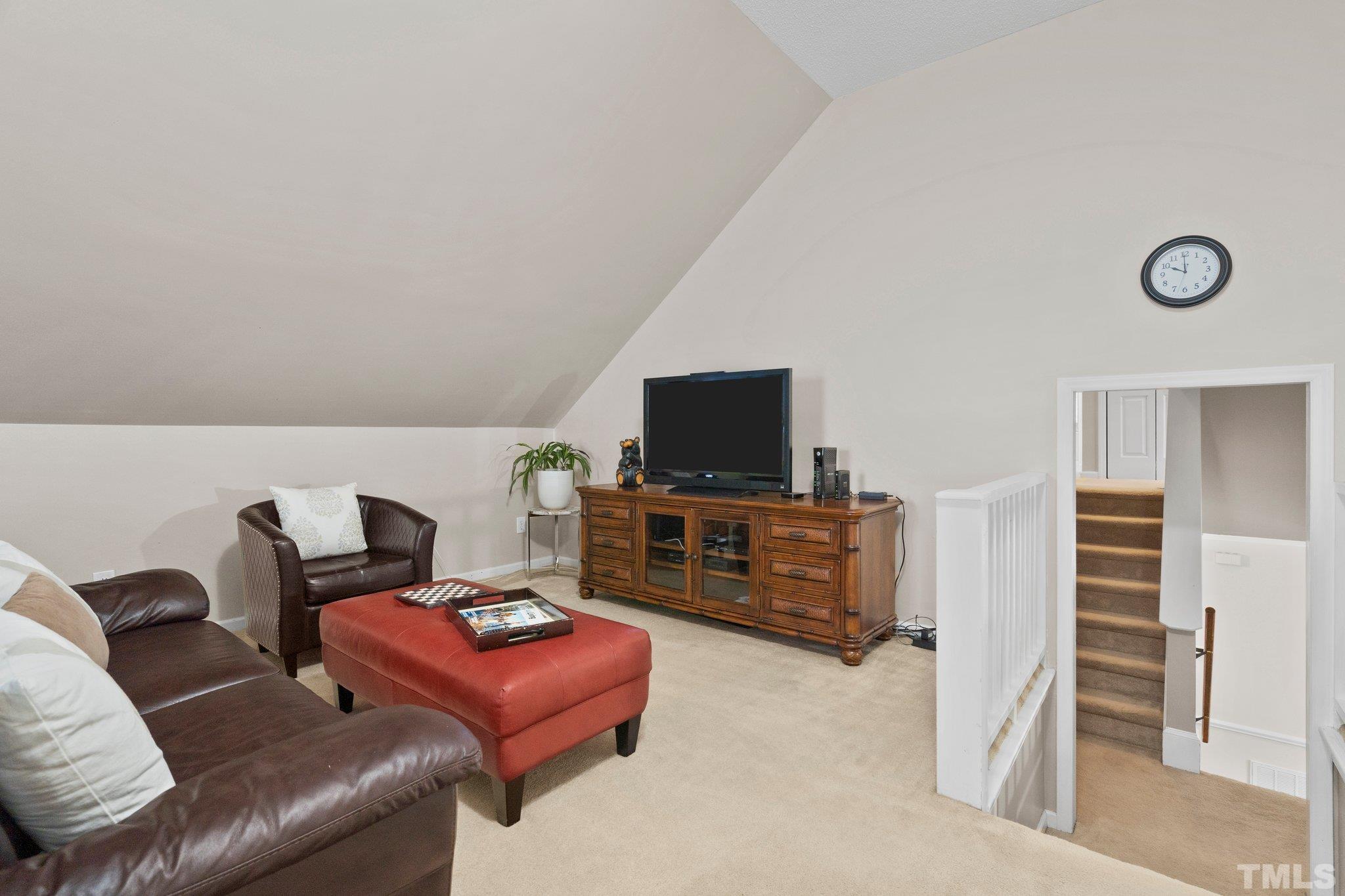 102 Sequoia Court Cary, NC 27513 - Photo 32 of 36 a living room with furniture and a flat screen tv