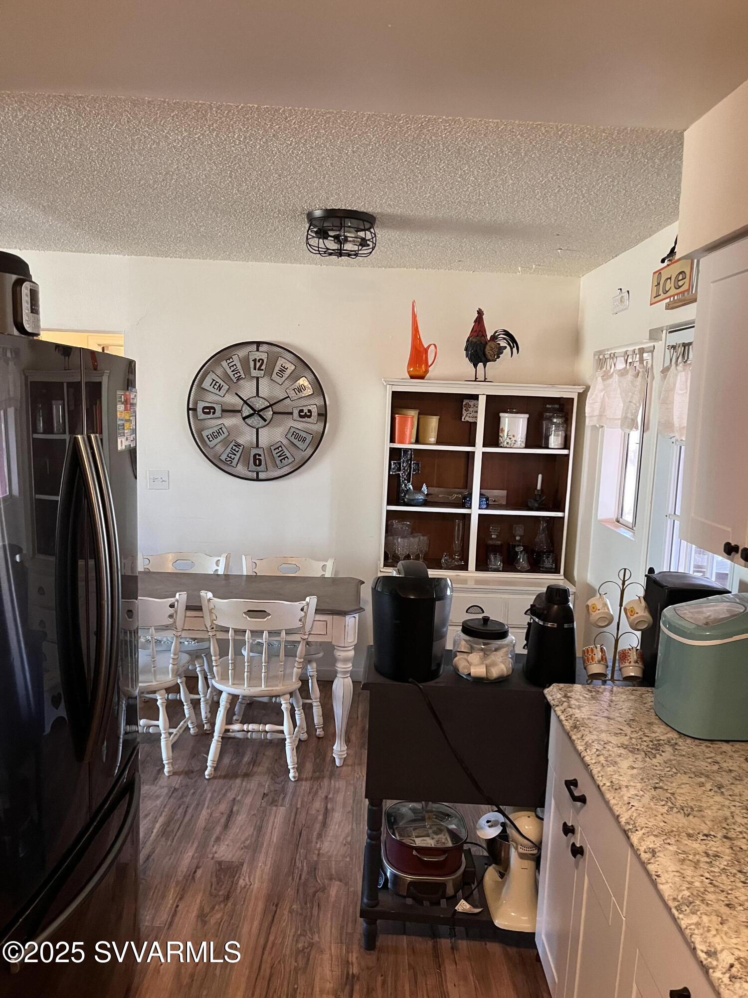 3405 South Silver Road Camp Verde, AZ 86322 - Photo 13 of 56 a view of a workspace with furniture and wooden floor