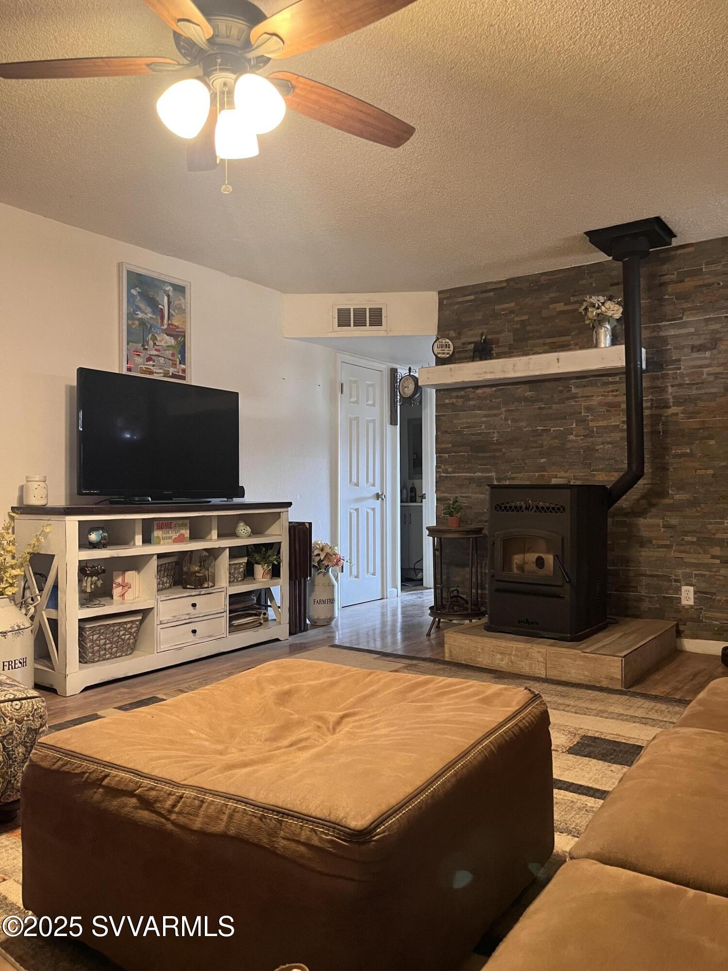 3405 South Silver Road Camp Verde, AZ 86322 - Photo 16 of 56 a room with furniture and flat screen tv