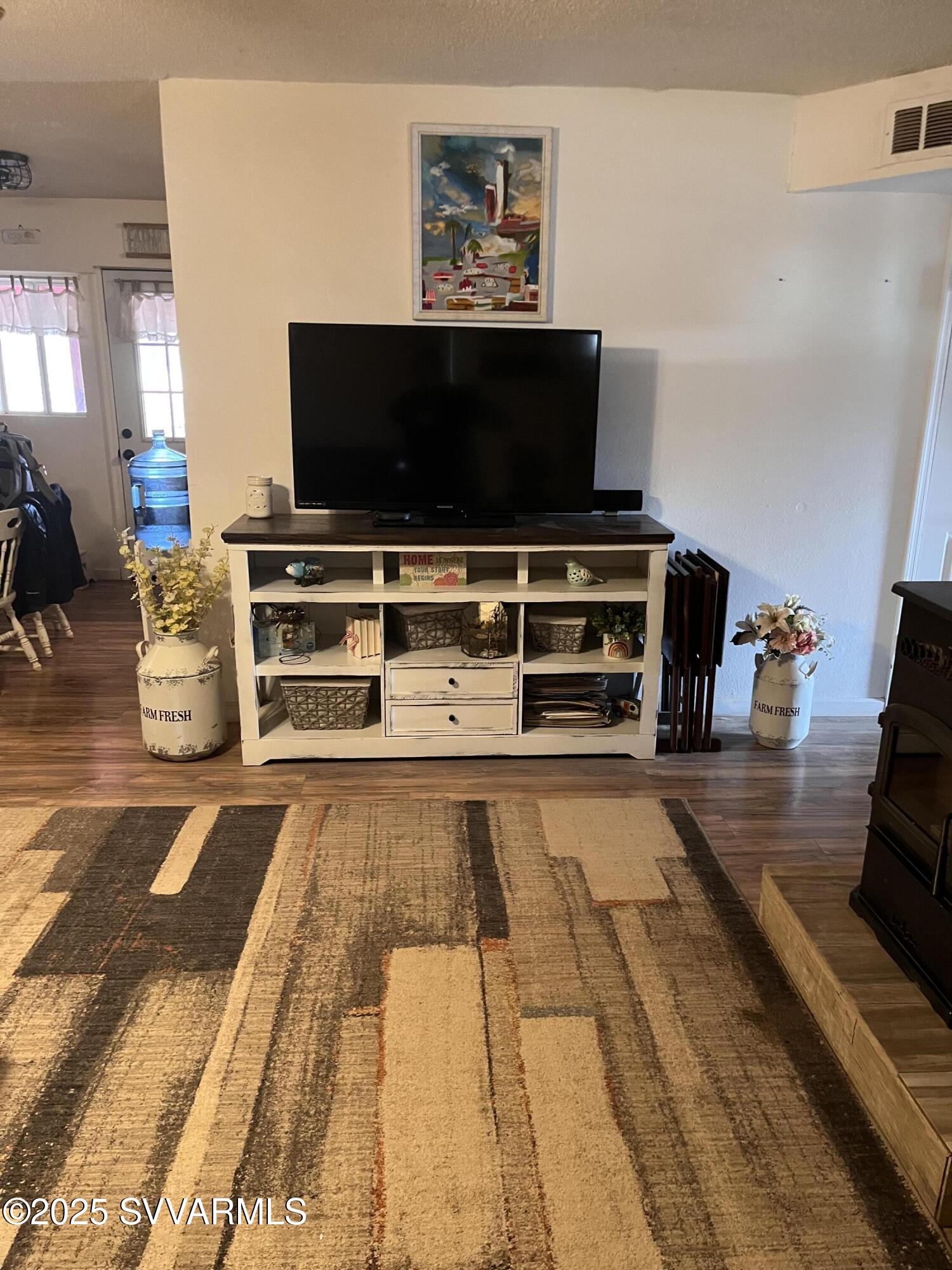 3405 South Silver Road Camp Verde, AZ 86322 - Photo 18 of 56 a living room with furniture and a flat screen tv