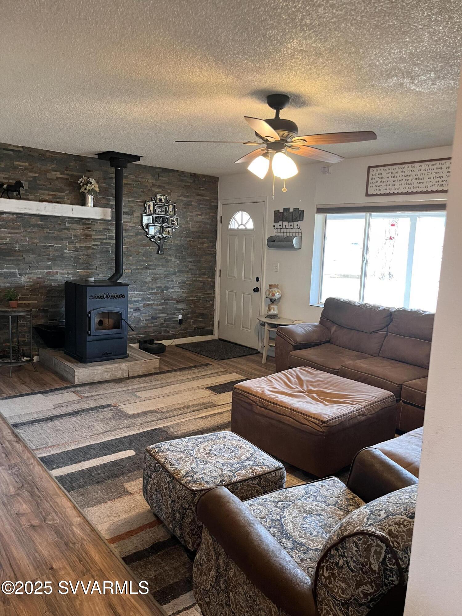 3405 South Silver Road Camp Verde, AZ 86322 - Photo 19 of 56 a living room with furniture and a fireplace