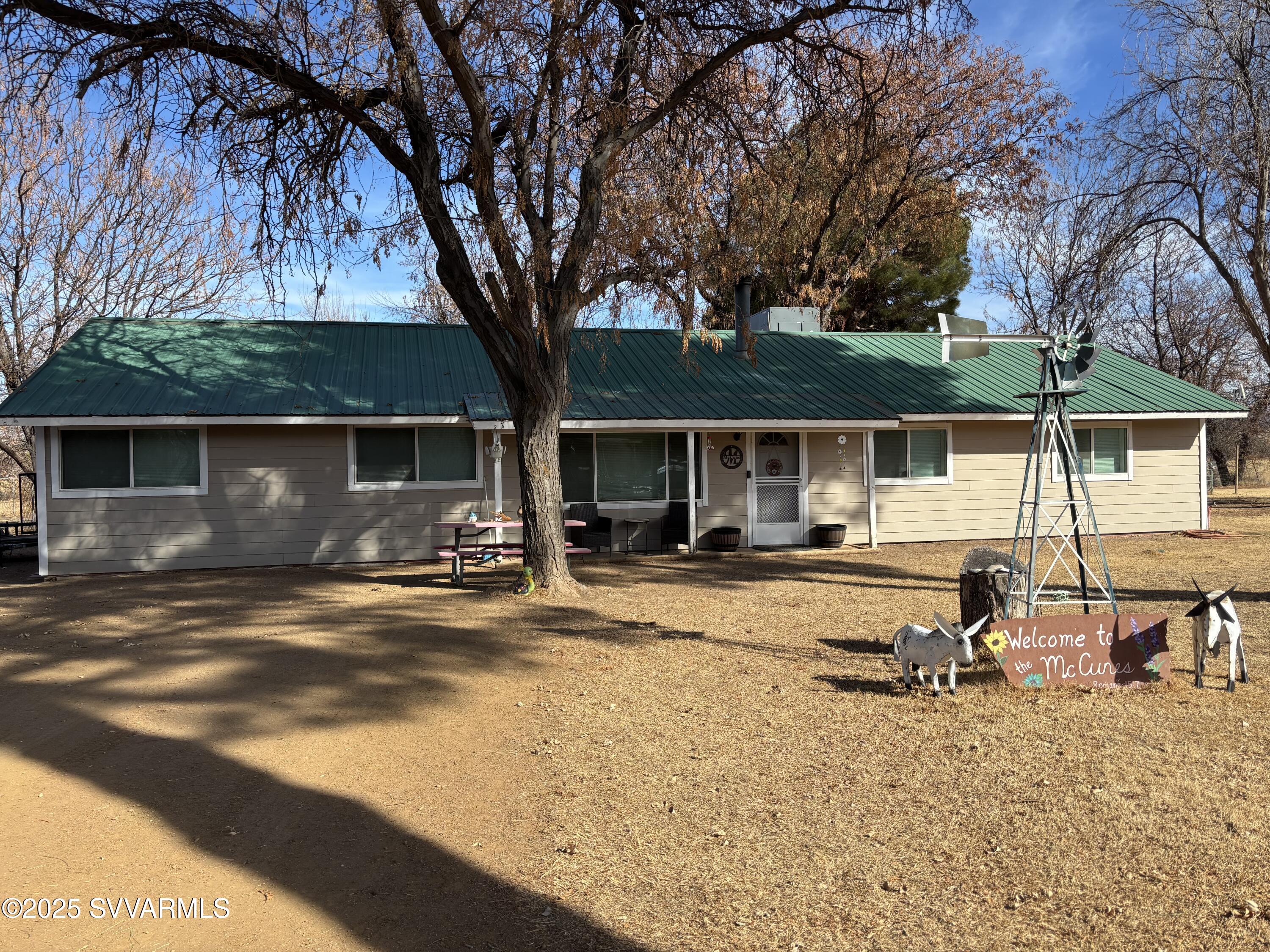 3405 South Silver Road Camp Verde, AZ 86322 - Photo 2 of 56 a swimming pool with outdoor seating and yard
