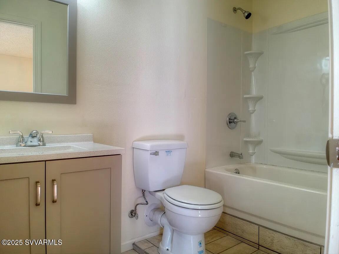 3405 South Silver Road Camp Verde, AZ 86322 - Photo 29 of 56 a bathroom with a sink a toilet and shower