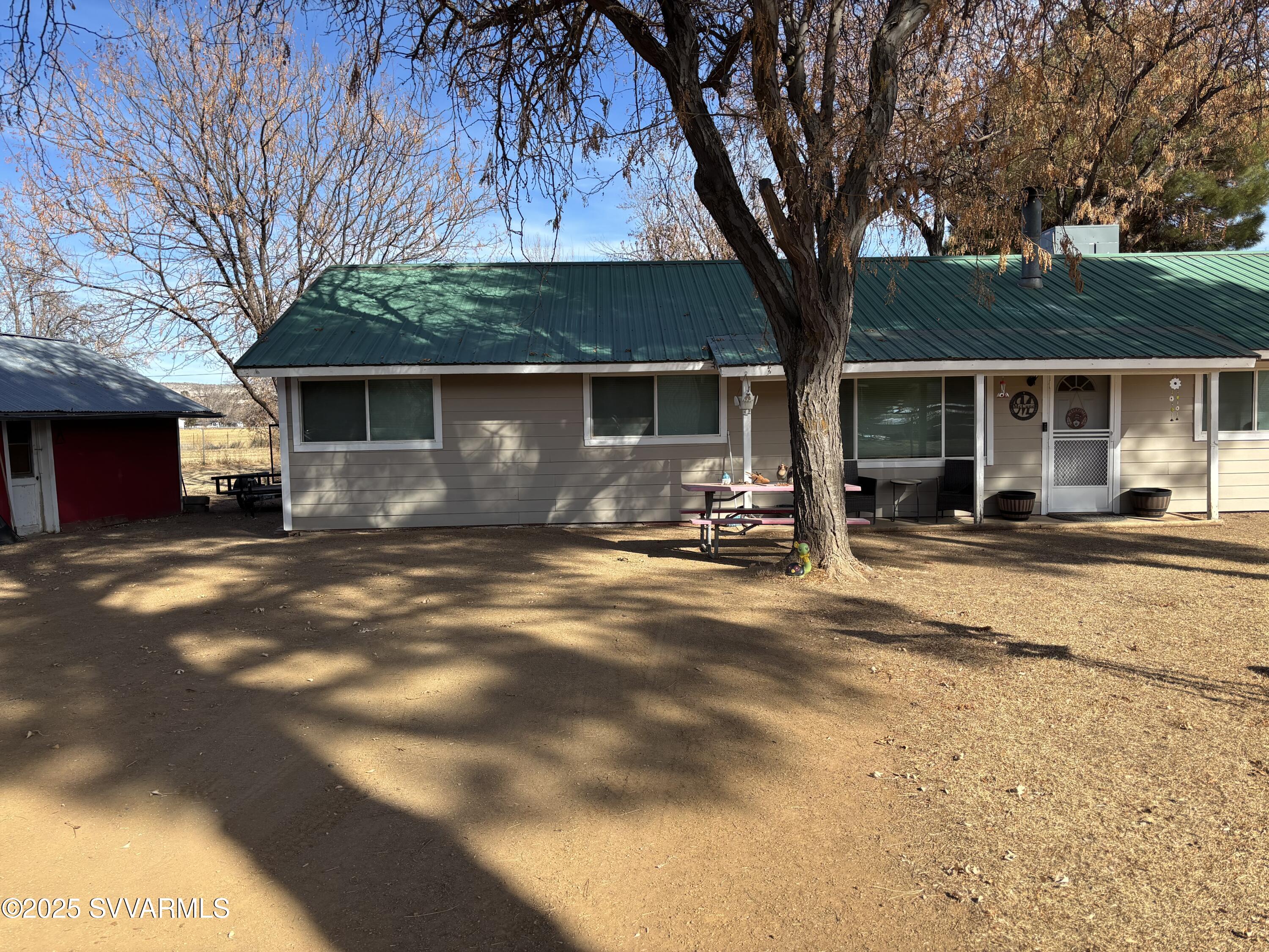 3405 South Silver Road Camp Verde, AZ 86322 - Photo 3 of 56 a front view of house with yard and trees around