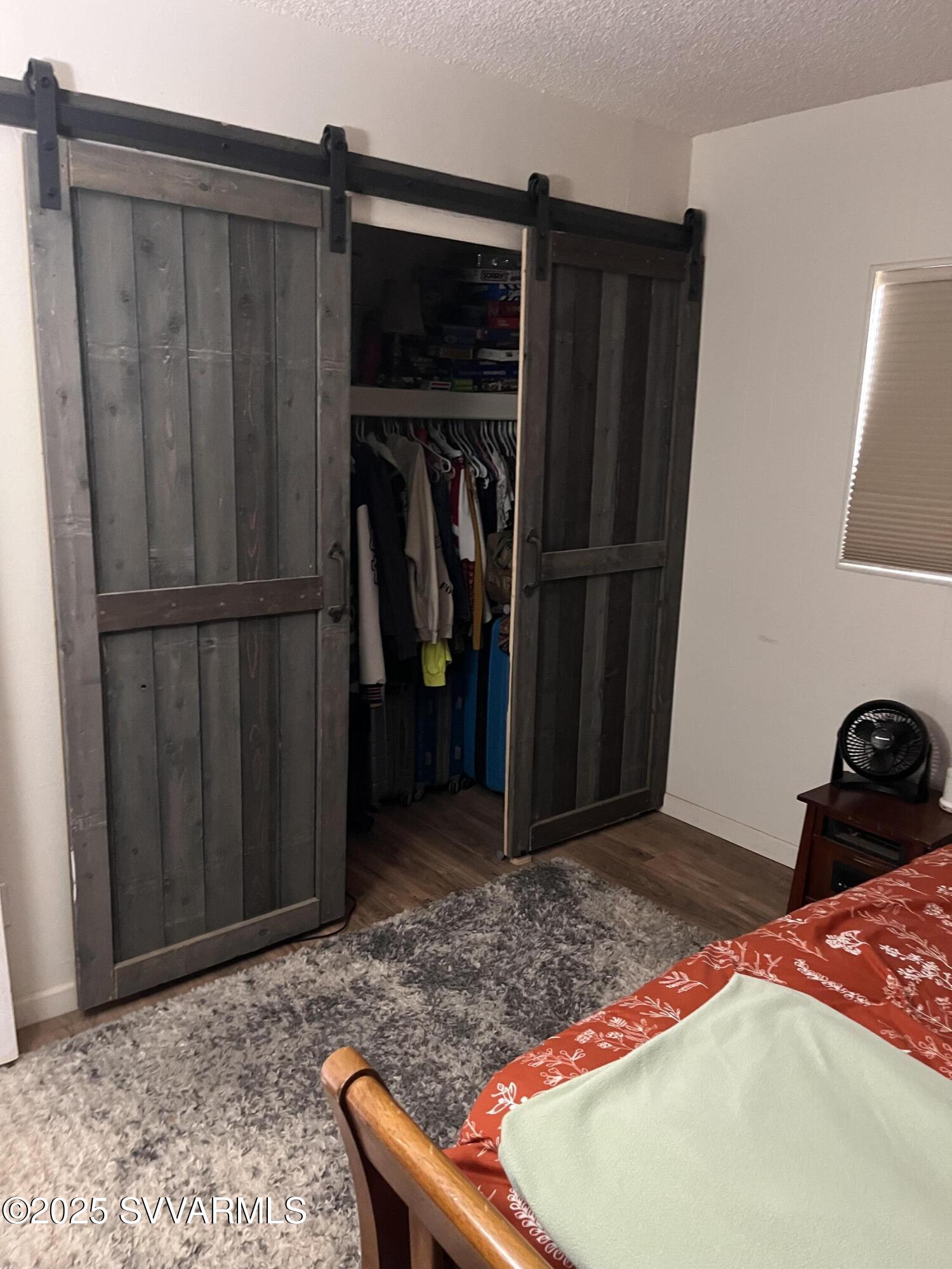 3405 South Silver Road Camp Verde, AZ 86322 - Photo 40 of 56 a bedroom with a bed and a mirror