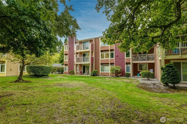 front view of a brick house with a yard