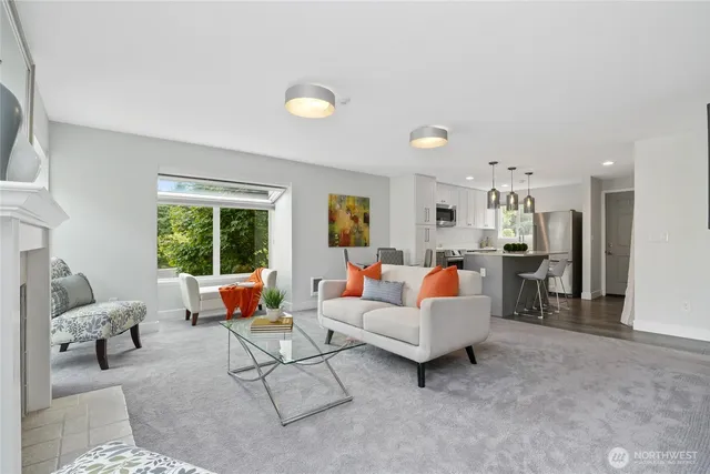 a living room with furniture and a large window