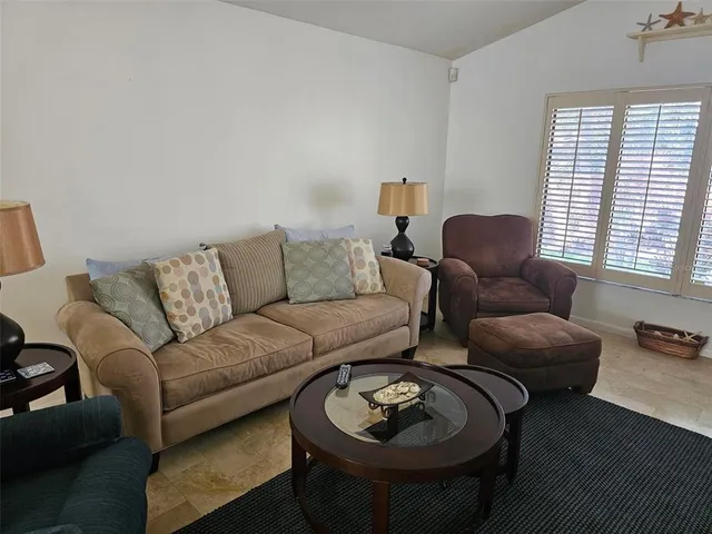 a living room with furniture and a window