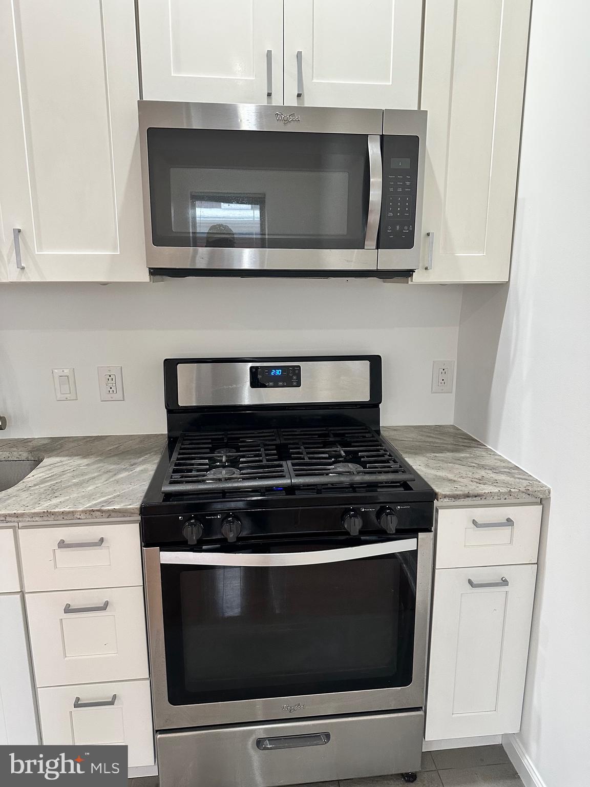 1128 South 19th Street, Unit A Philadelphia, PA 19146 - Photo 3 of 17 a stove top oven sitting inside of a kitchen