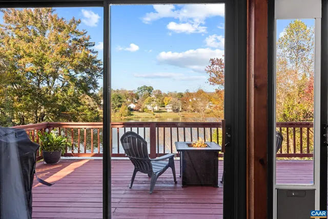 a kitchen with a refrigerator and a stove top oven