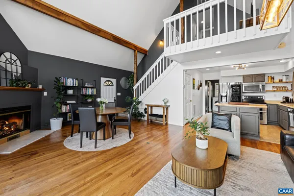 a bedroom with a bed chair and a large window