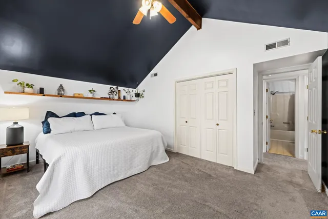 a view of a lake with houses in the back