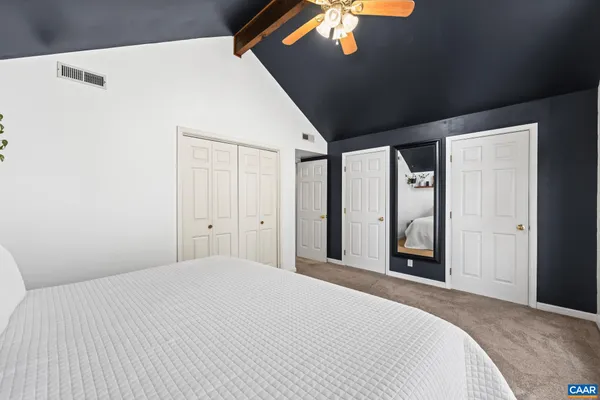 a view of city from a balcony with outdoor seating