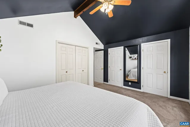 a view of city from a balcony with outdoor seating