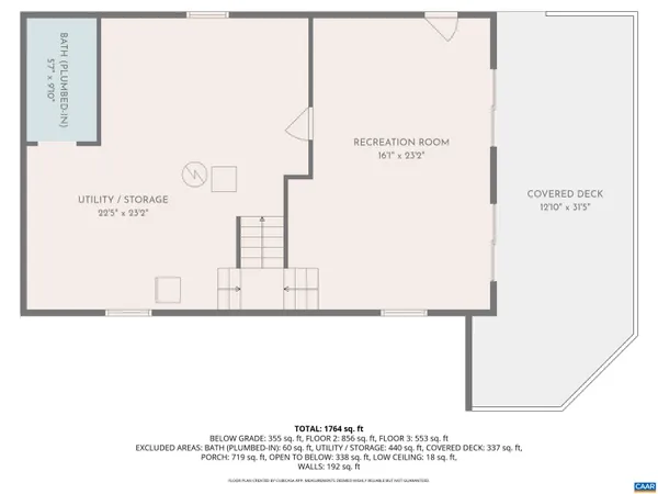 a small pool with table and chairs under an umbrella