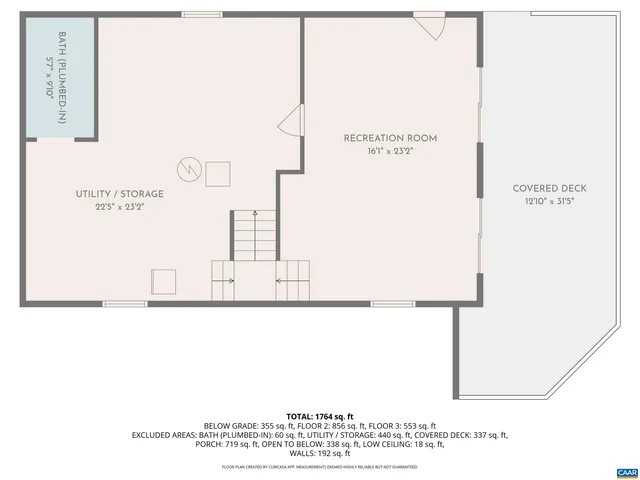 a small pool with table and chairs under an umbrella