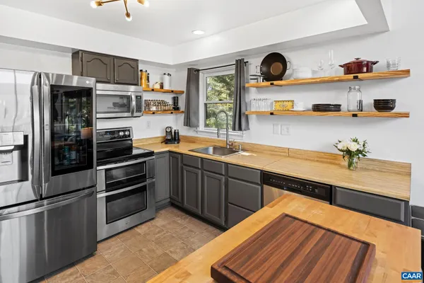 a spacious bedroom with a bed and a window