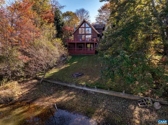an outdoor space with furniture and water view