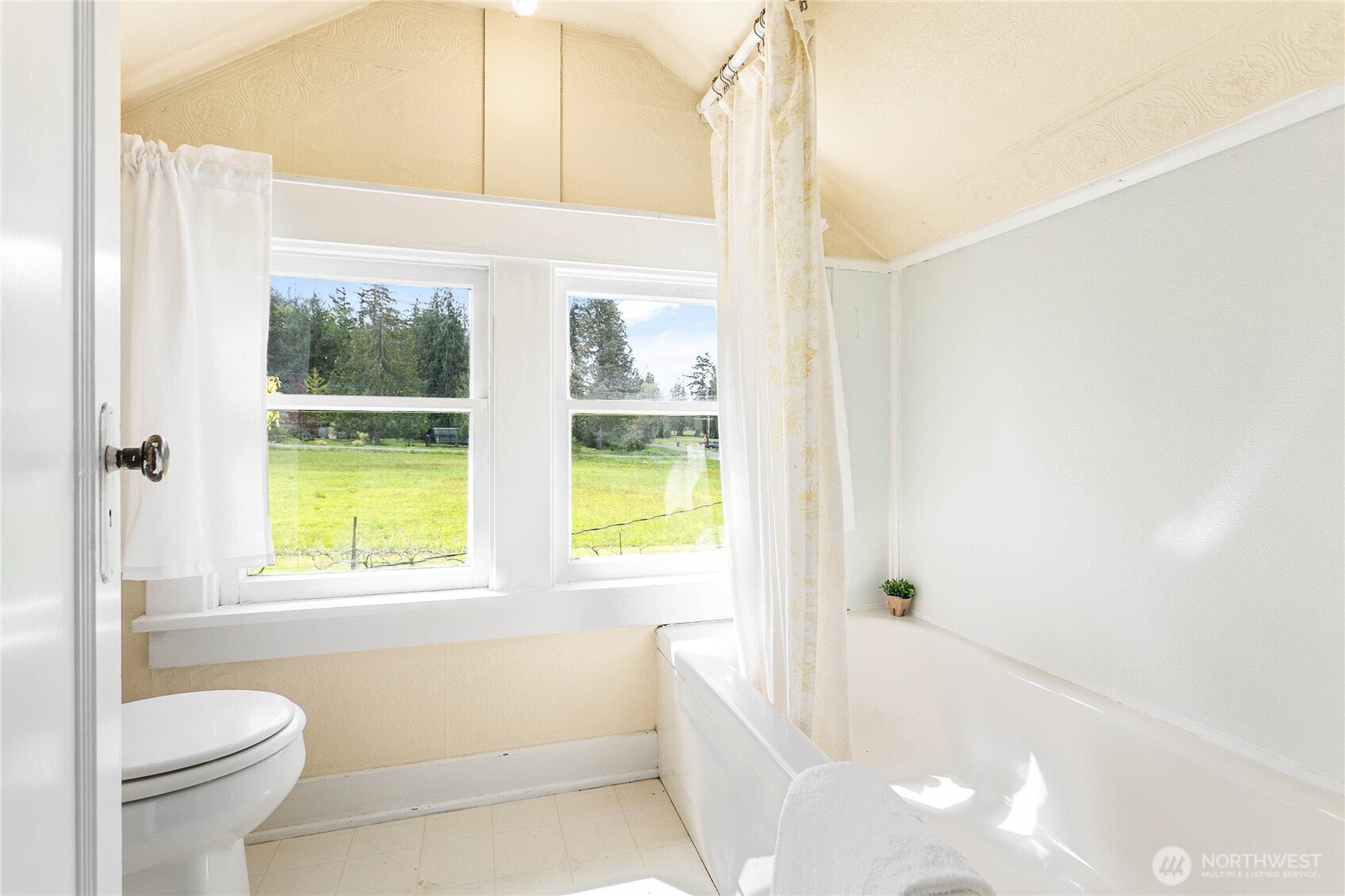 4918 Sand Road Bellingham, WA 98226 - Photo 18 of 39 a bathroom with a bathtub and a shower