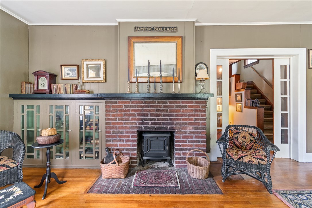 4007 Ridge Road Williamson, NY 14589 - Photo 18 of 34 The fireplace is flanked by BUILT IN SHELVING - note the pocket doors!