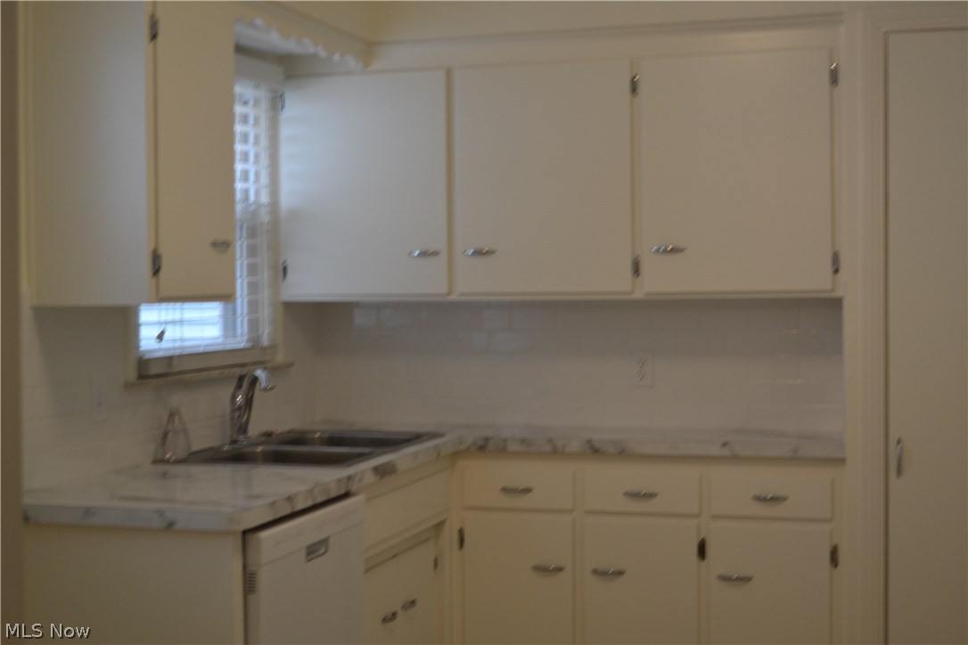1663 Oakmount Road South Euclid, OH 44121 - Photo 12 of 23 2017 Tile Backsplash, Sink, Faucet, Counter Tops in Kitchen