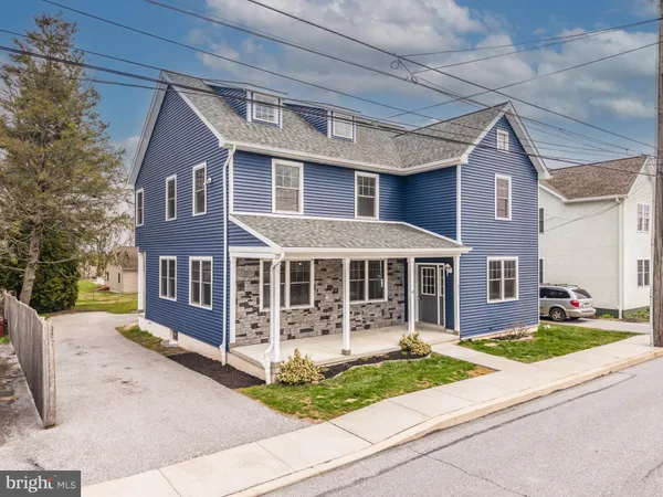 front view of a house with a yard