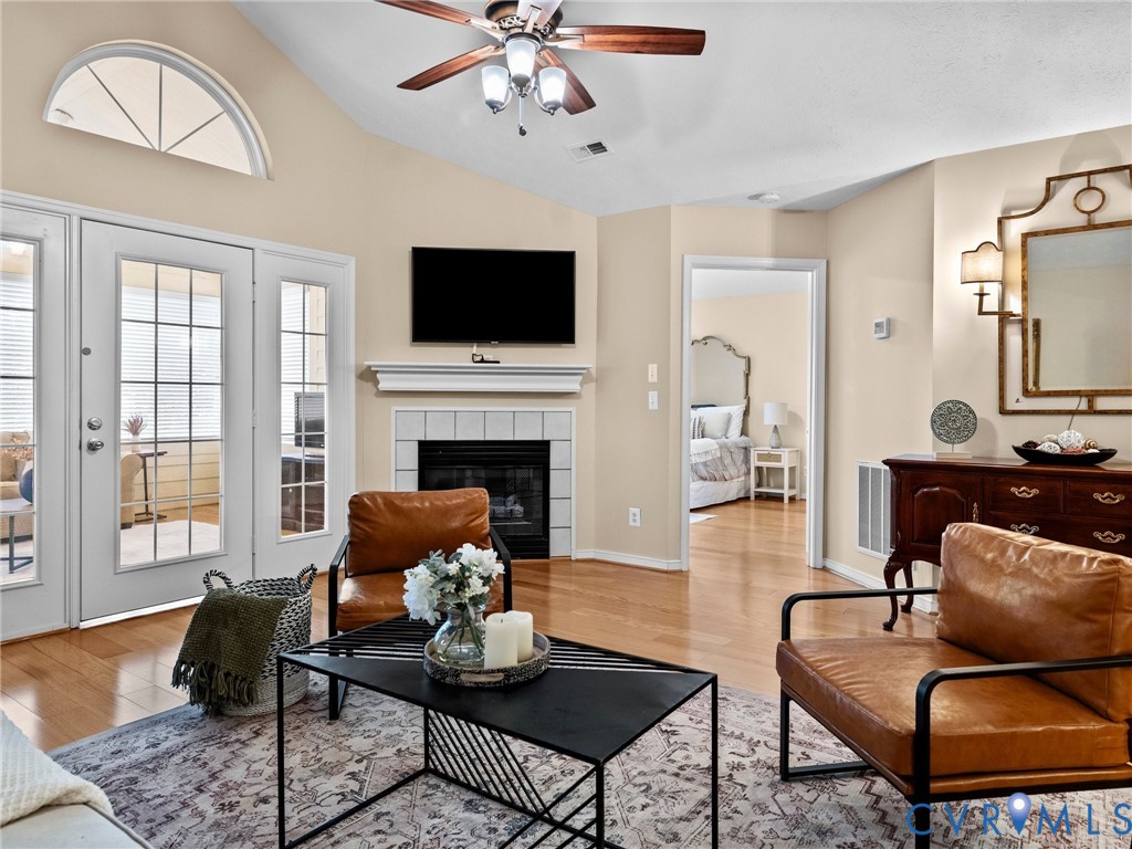 1338 Tannery Circle Midlothian, VA 23113 - Photo 11 of 37 a living room with furniture a fireplace and a flat screen tv