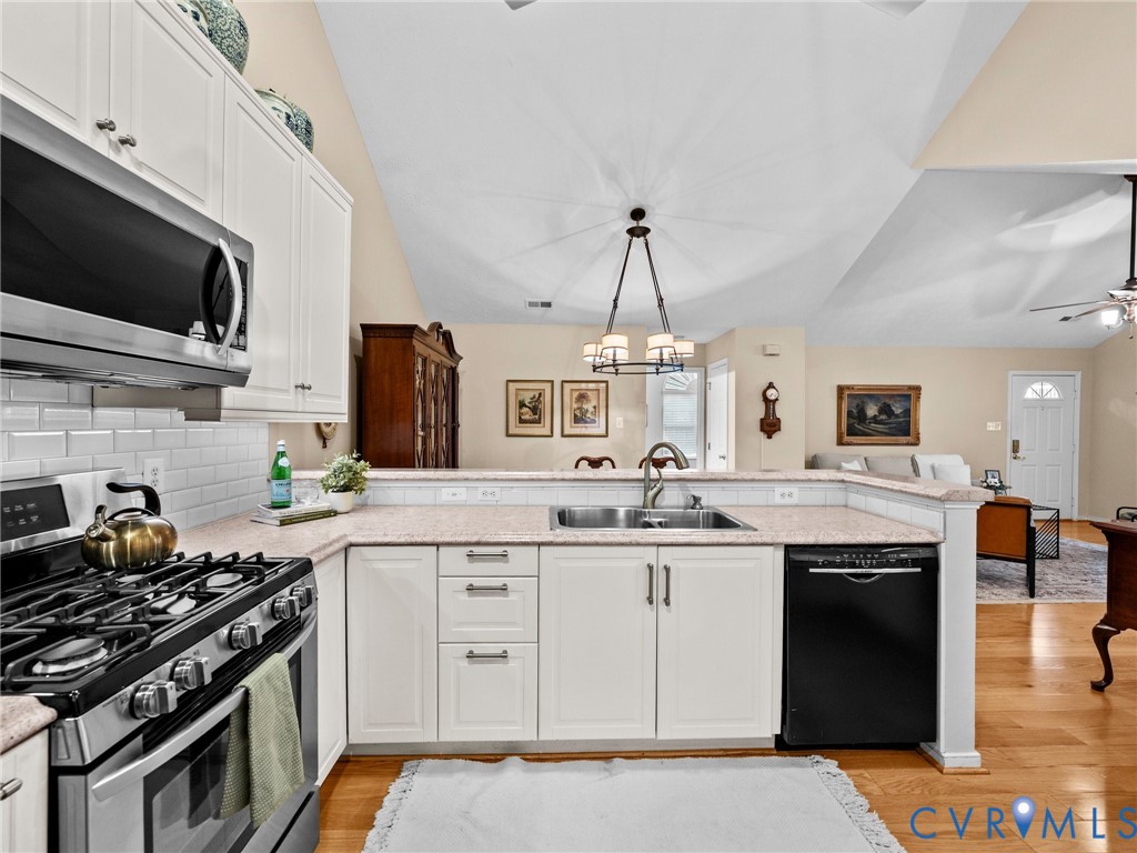 1338 Tannery Circle Midlothian, VA 23113 - Photo 20 of 37 a kitchen with stainless steel appliances granite countertop a stove and a sink