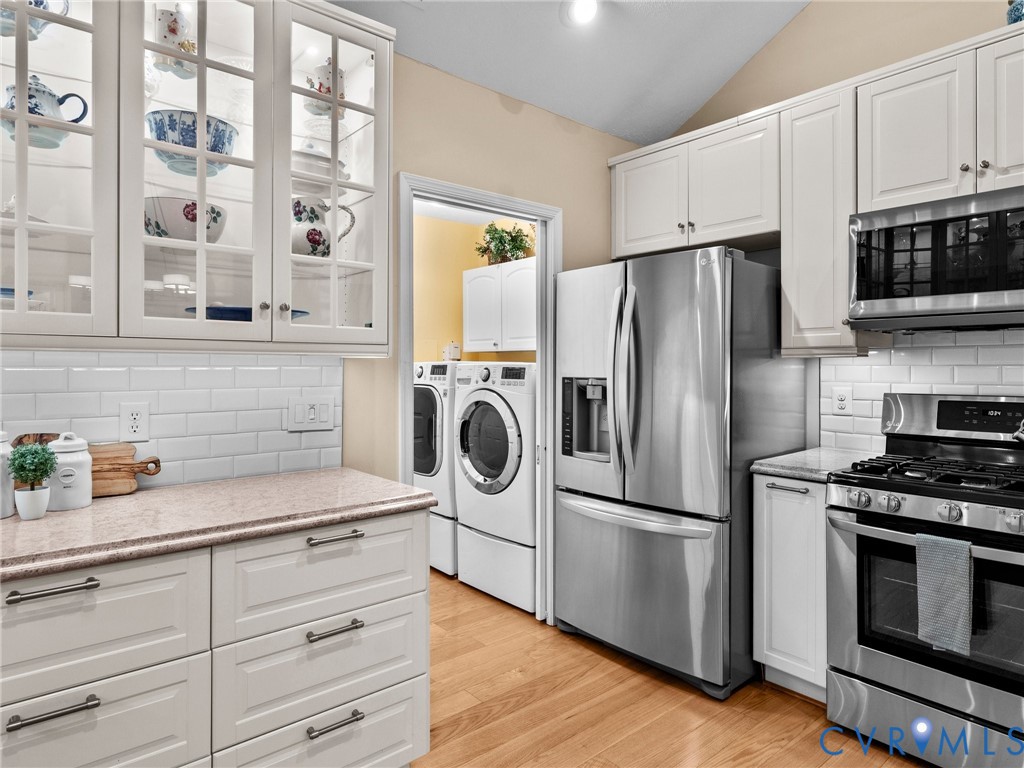 1338 Tannery Circle Midlothian, VA 23113 - Photo 21 of 37 a kitchen with stainless steel appliances a refrigerator stove and microwave