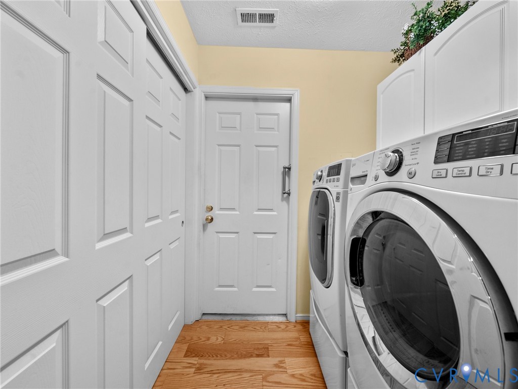 1338 Tannery Circle Midlothian, VA 23113 - Photo 22 of 37 a view of a hallway with washer and dryer