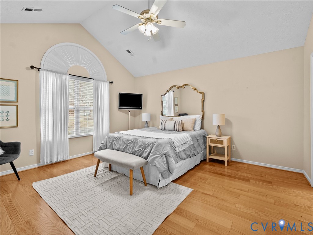 1338 Tannery Circle Midlothian, VA 23113 - Photo 24 of 37 a bedroom with a bed wooden floor and window