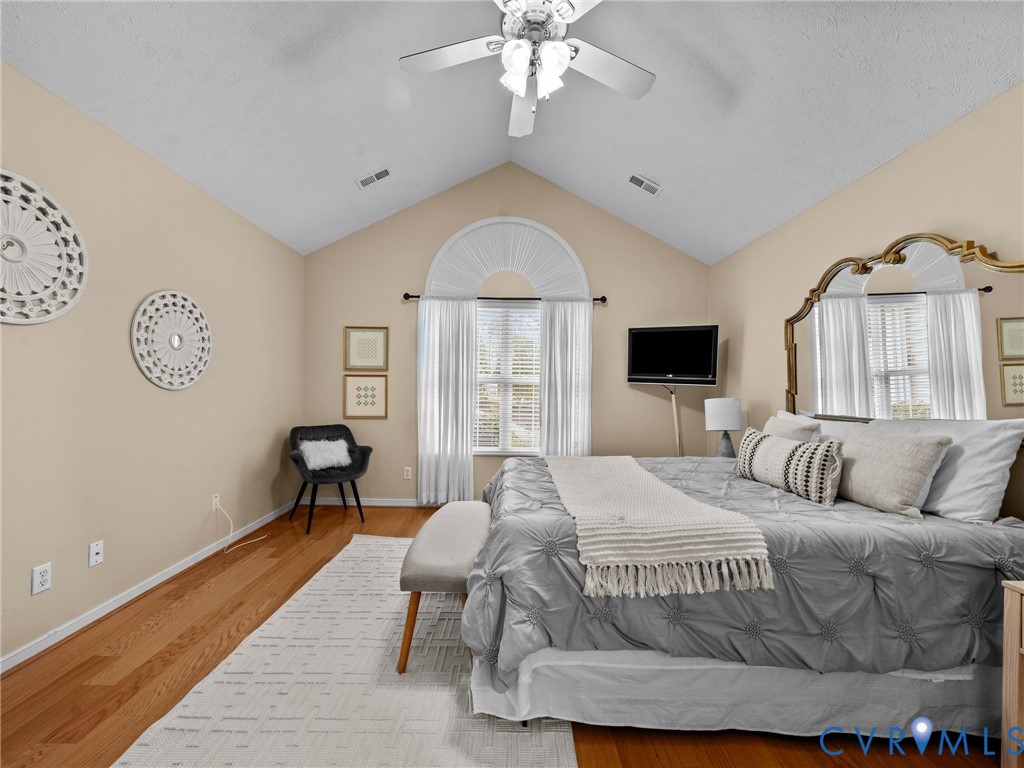 1338 Tannery Circle Midlothian, VA 23113 - Photo 25 of 37 a bedroom with a bed and a chandelier