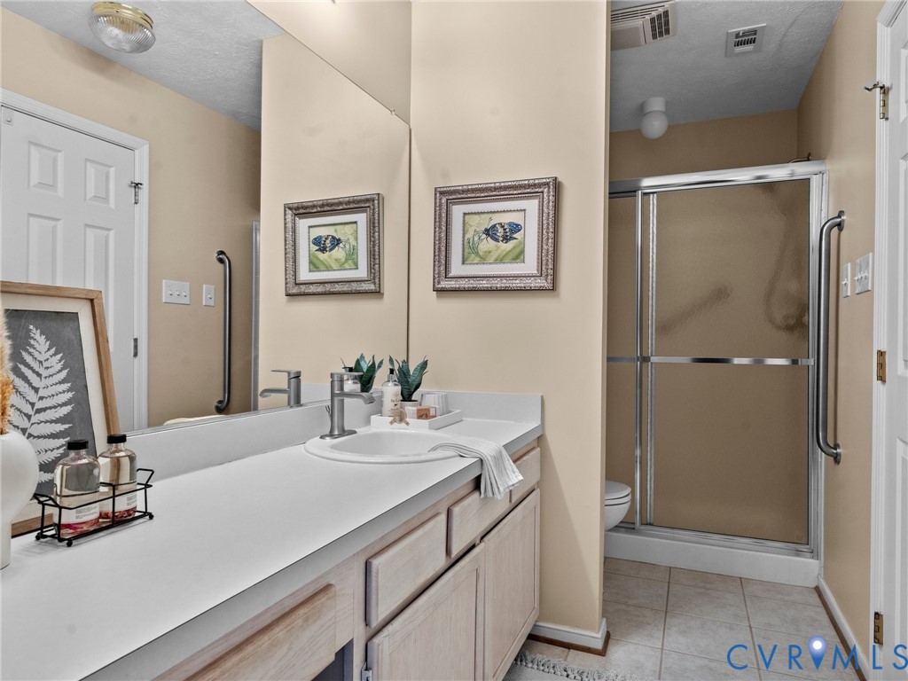 1338 Tannery Circle Midlothian, VA 23113 - Photo 28 of 37 a bathroom with a sink vanity and a mirror