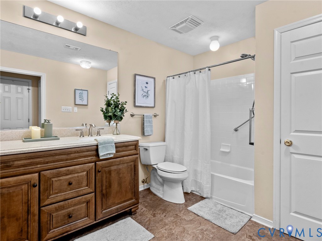 1338 Tannery Circle Midlothian, VA 23113 - Photo 32 of 37 a view of bathroom with a toilet sink mirror and vanity