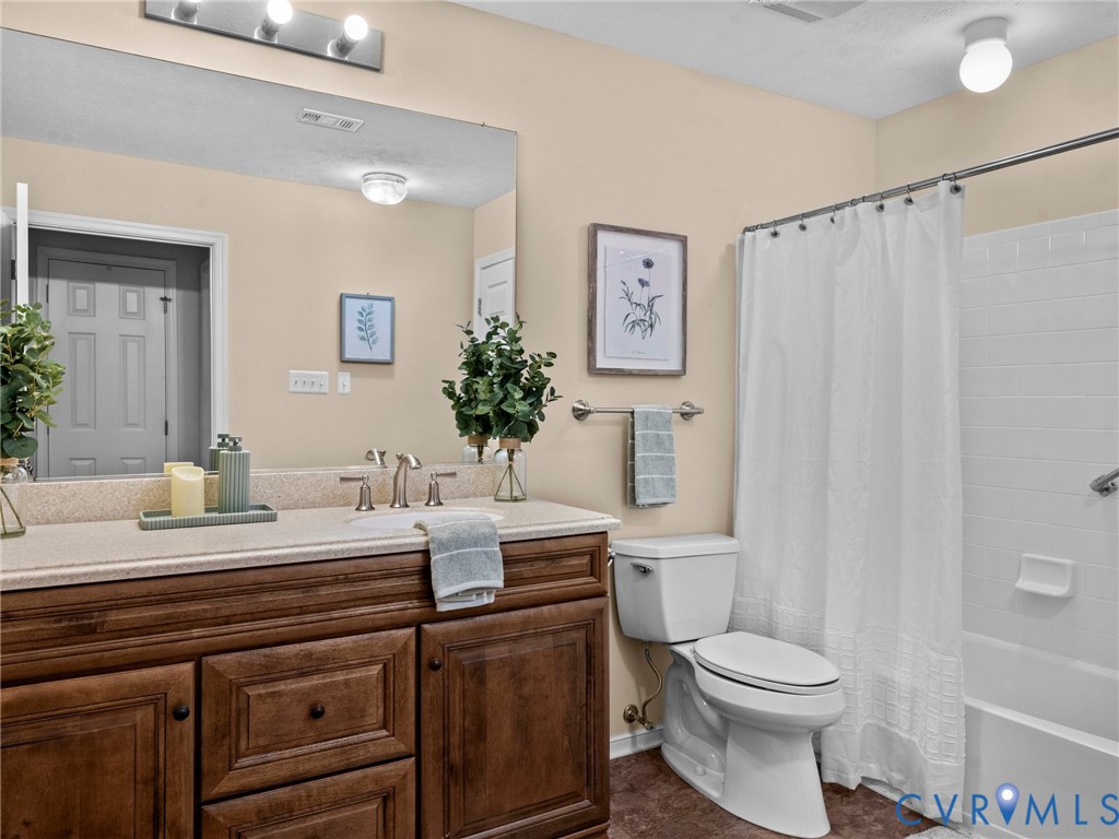 1338 Tannery Circle Midlothian, VA 23113 - Photo 33 of 37 a view of bathroom with a toilet sink and mirror