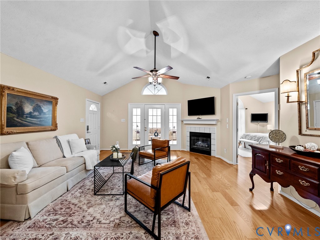 1338 Tannery Circle Midlothian, VA 23113 - Photo 10 of 37 a living room with furniture a fireplace and a flat screen tv