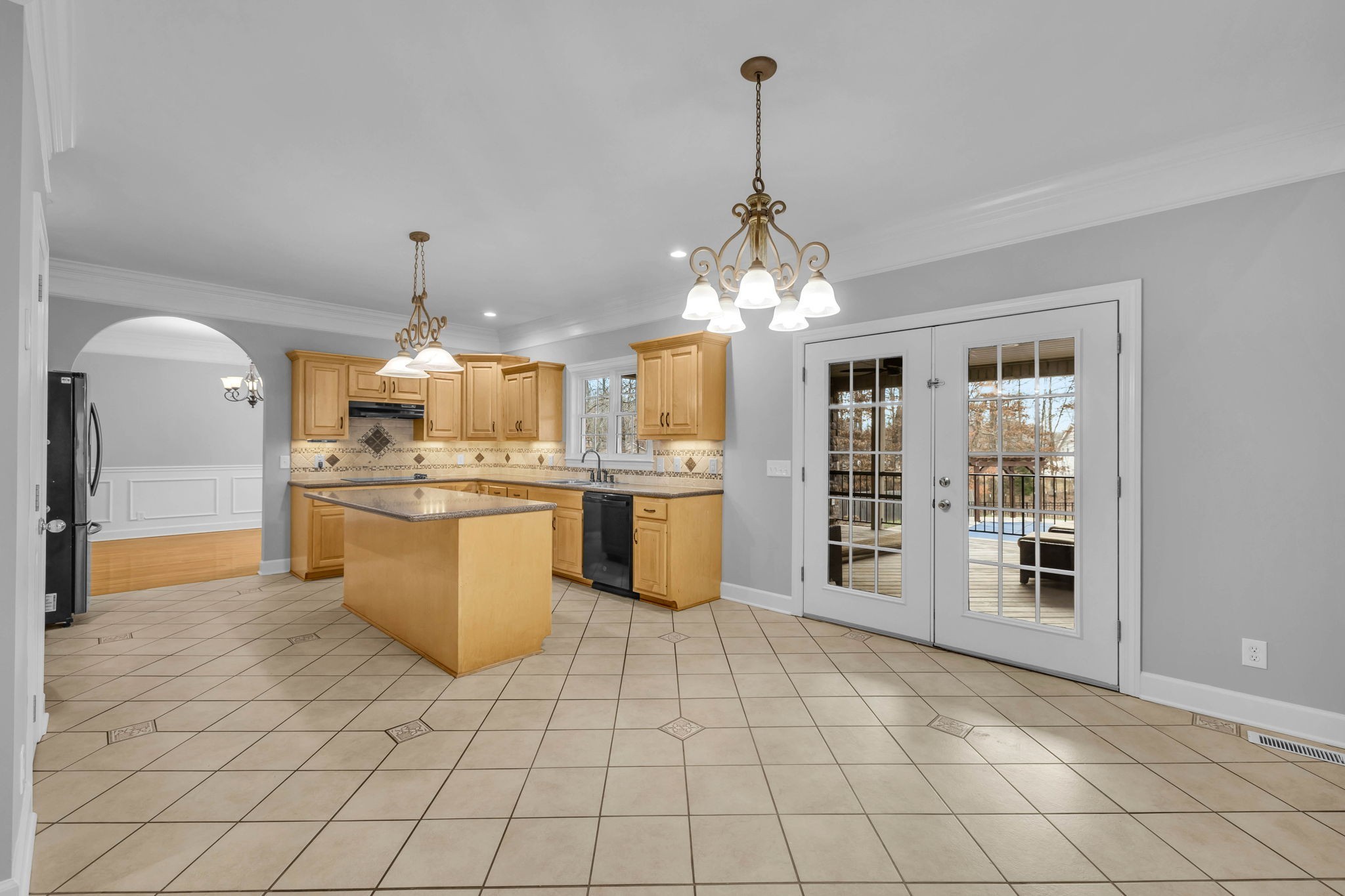 1273 Cedar Grove Road Lebanon, TN 37087 - Photo 19 of 52 a large kitchen with stainless steel appliances kitchen island granite countertop a stove a sink and a refrigerator