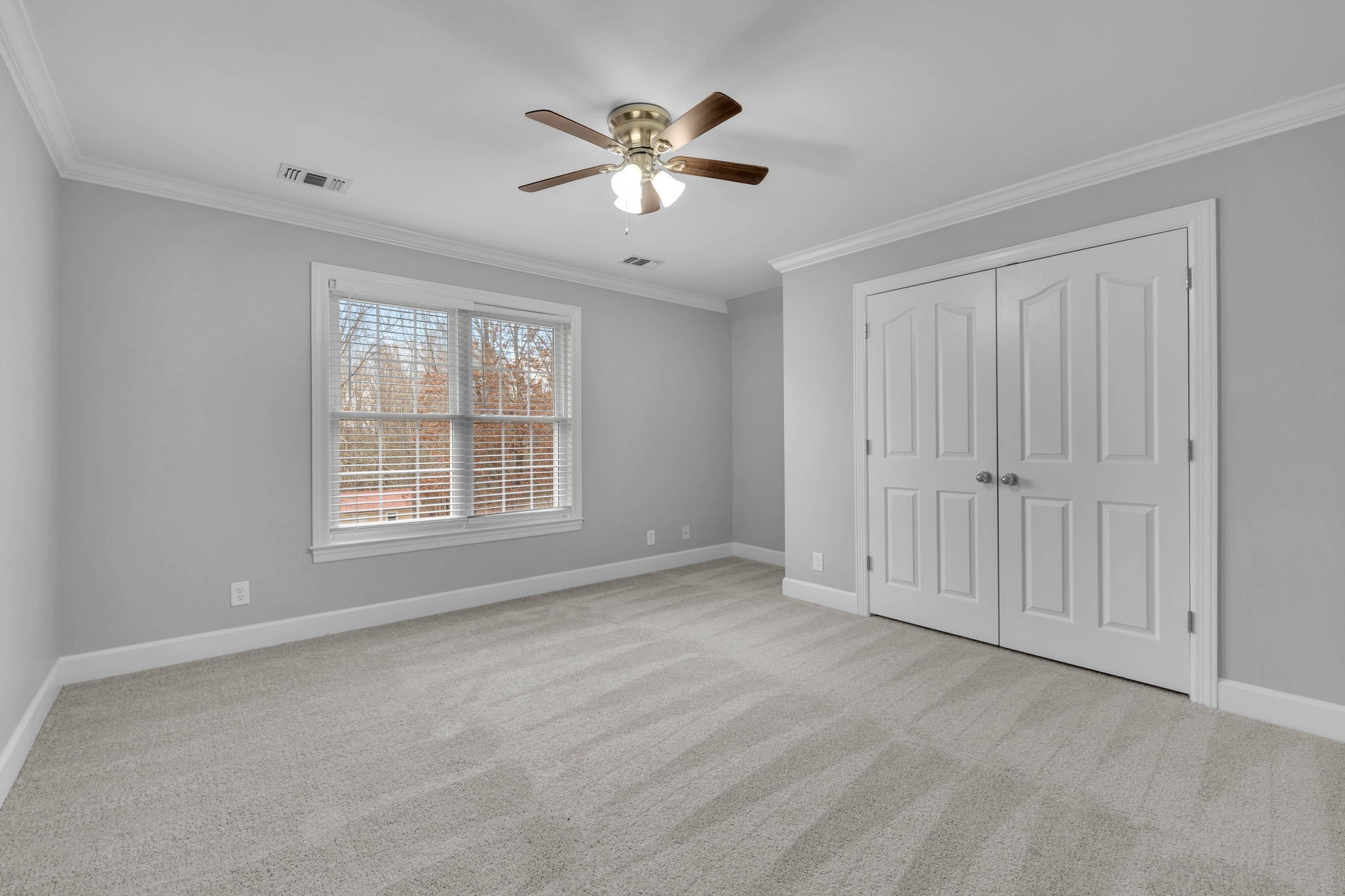 1273 Cedar Grove Road Lebanon, TN 37087 - Photo 30 of 52 an empty room with chandelier fan and windows