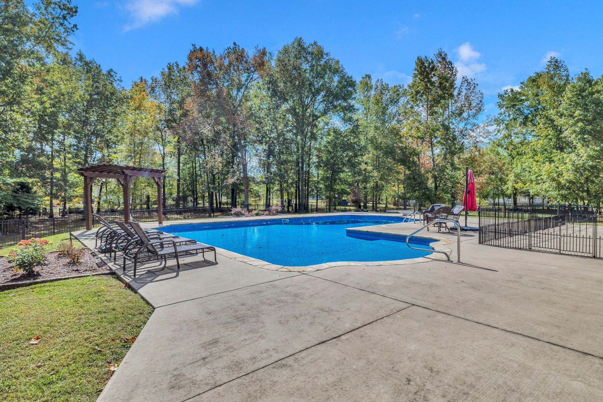 1273 Cedar Grove Road Lebanon, TN 37087 - Photo 37 of 52 a view of a swimming pool with sitting area and garden