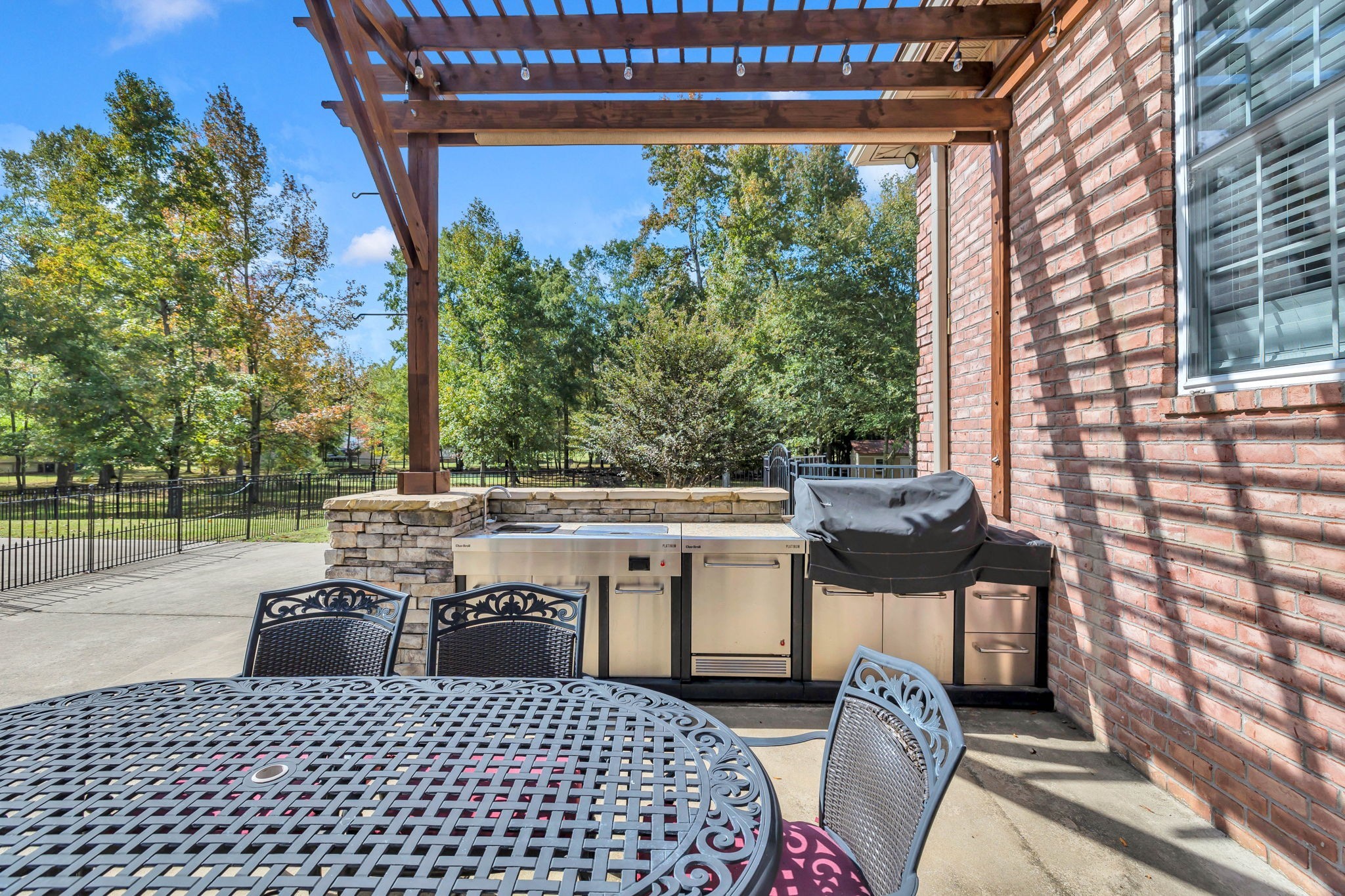 1273 Cedar Grove Road Lebanon, TN 37087 - Photo 38 of 52 a view of a patio with table and chairs with wooden floor and fence
