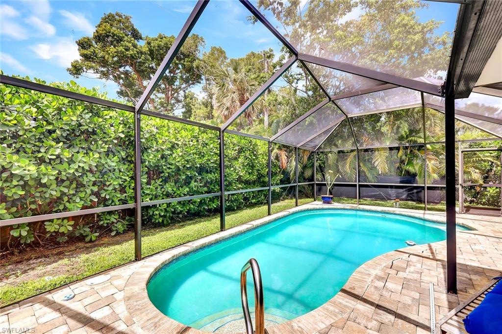 237 Burning Tree Drive Naples, FL 34105 - Photo 21 of 26 a view of a balcony with yard