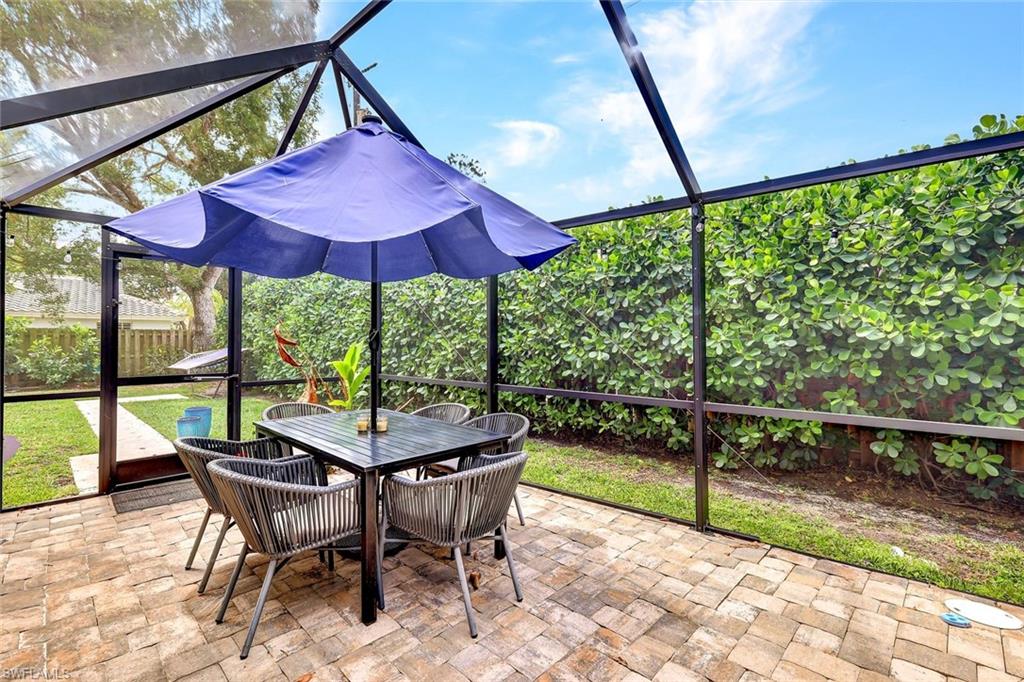 237 Burning Tree Drive Naples, FL 34105 - Photo 22 of 26 a view of an chairs and table in the patio