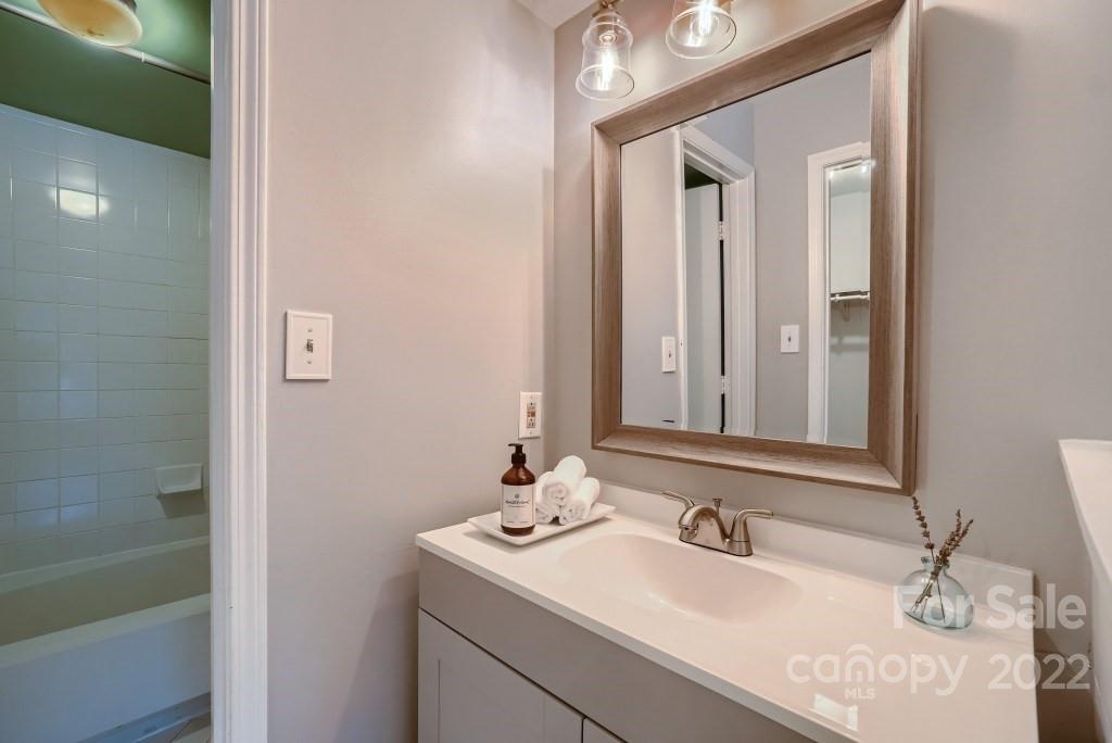 11320 Park Road Charlotte, NC 28226 - Photo 11 of 28 a bathroom with a sink and a mirror