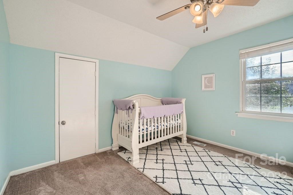 11320 Park Road Charlotte, NC 28226 - Photo 13 of 28 a view of a livingroom with a chandelier fan and a window