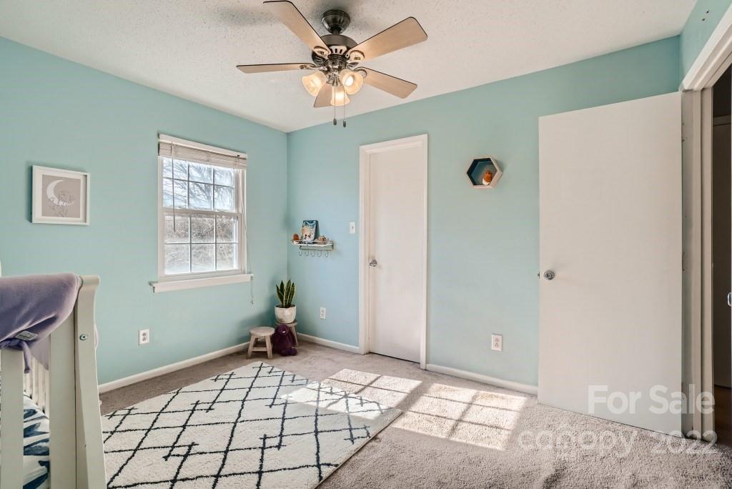 11320 Park Road Charlotte, NC 28226 - Photo 14 of 28 a bedroom with a bed and a window